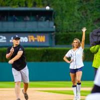 Individual throwing pitch at Comerica Park event